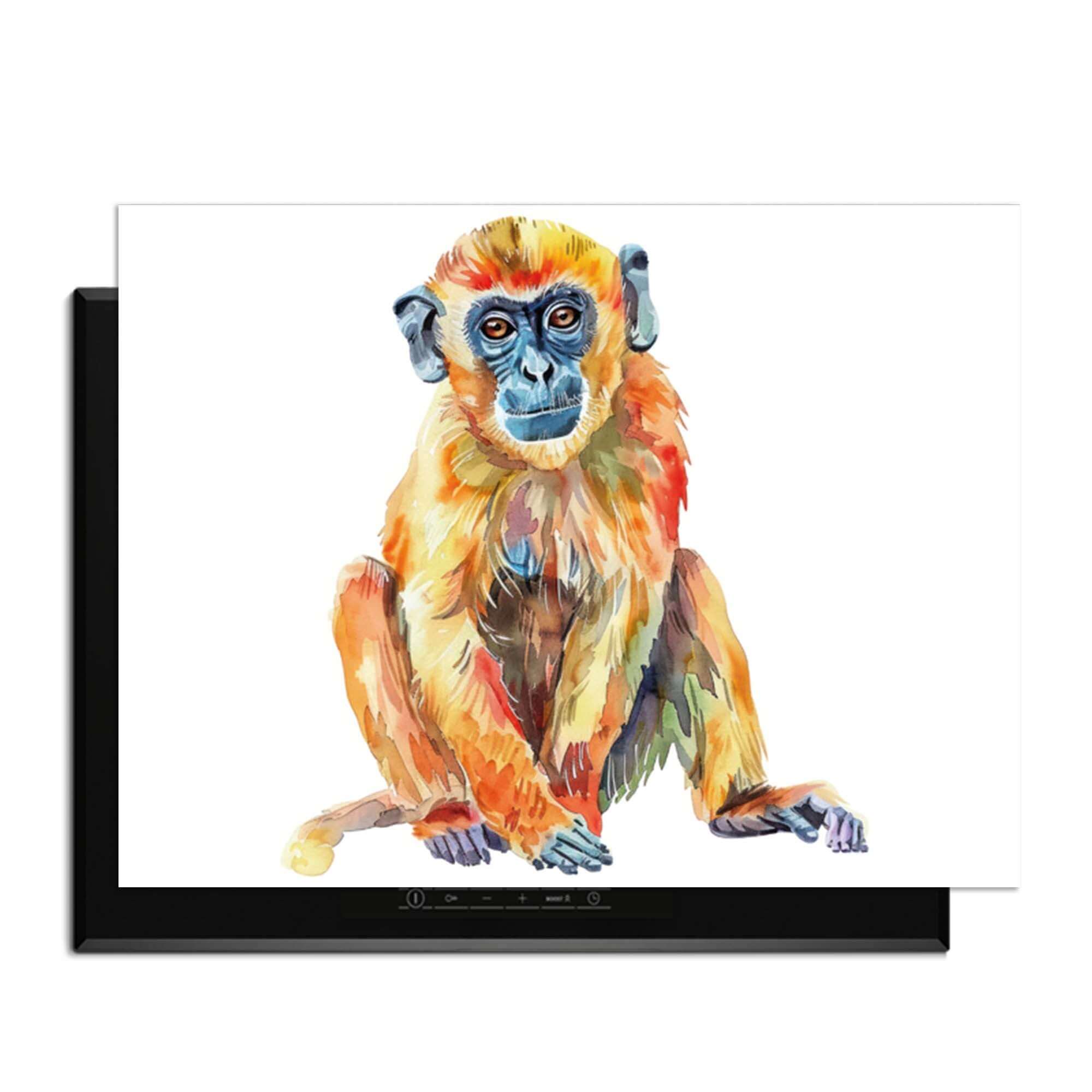 Bunter Affe - Herdabdeckplatte mit einem bunten Bild eines sitzenden Affen auf einer Induktionsplatte.