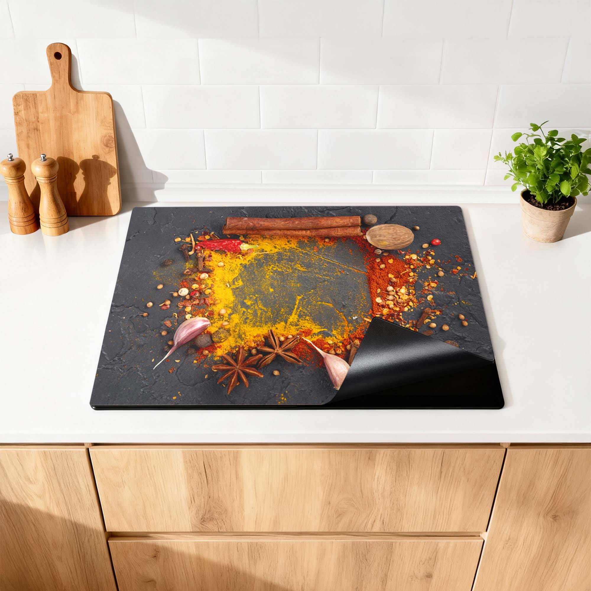 Eastern Spice Mix - Herdabdeckplatte mit bunten Gewürzen auf einer Arbeitsplatte.