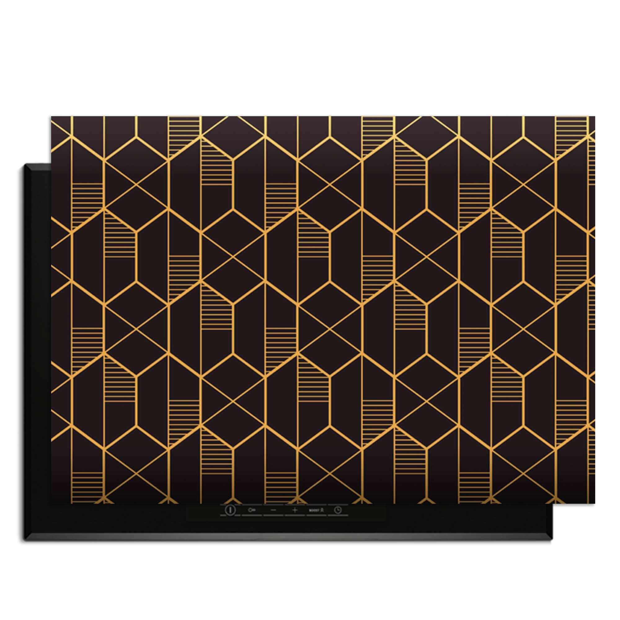 Goldenes Prisma - Herdabdeckplatte mit geometrischem goldenem Muster auf schwarzem Hintergrund.