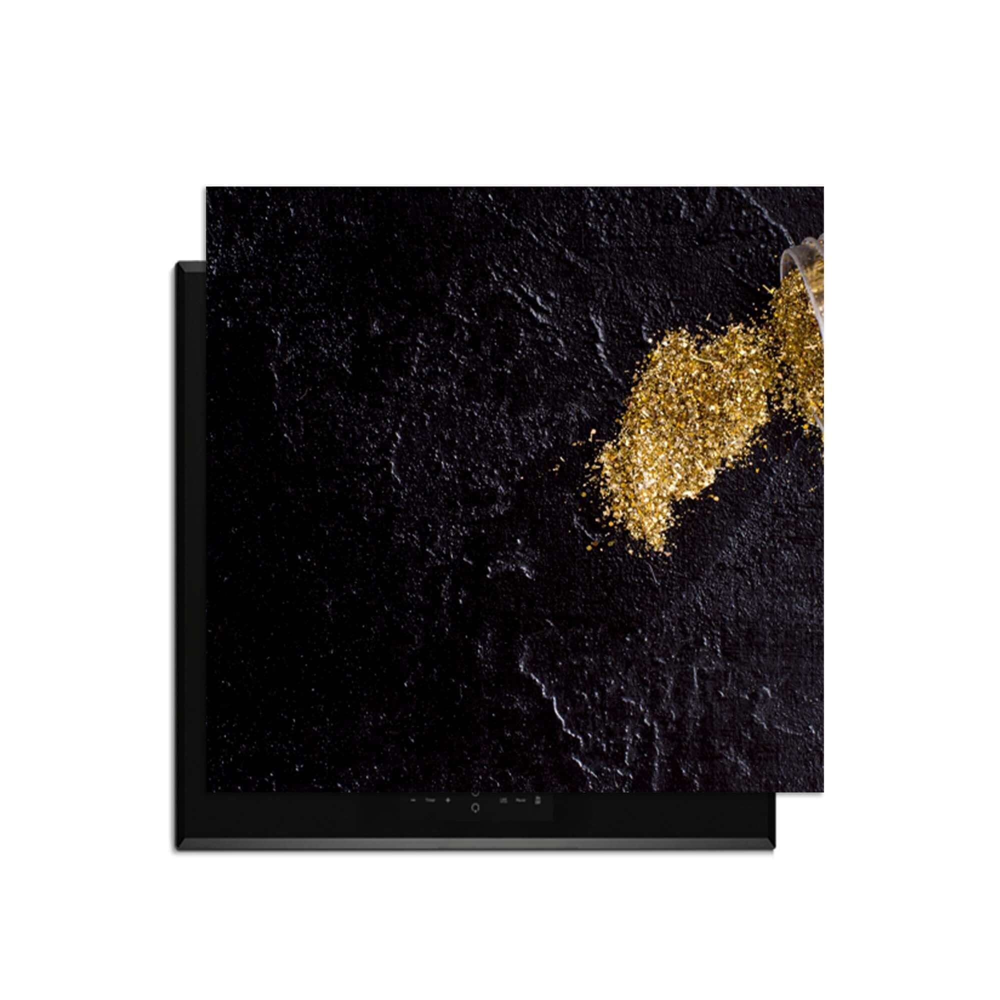Spilled Gold - Herdabdeckplatte auf einer Induktionsplatte mit Goldglitter.